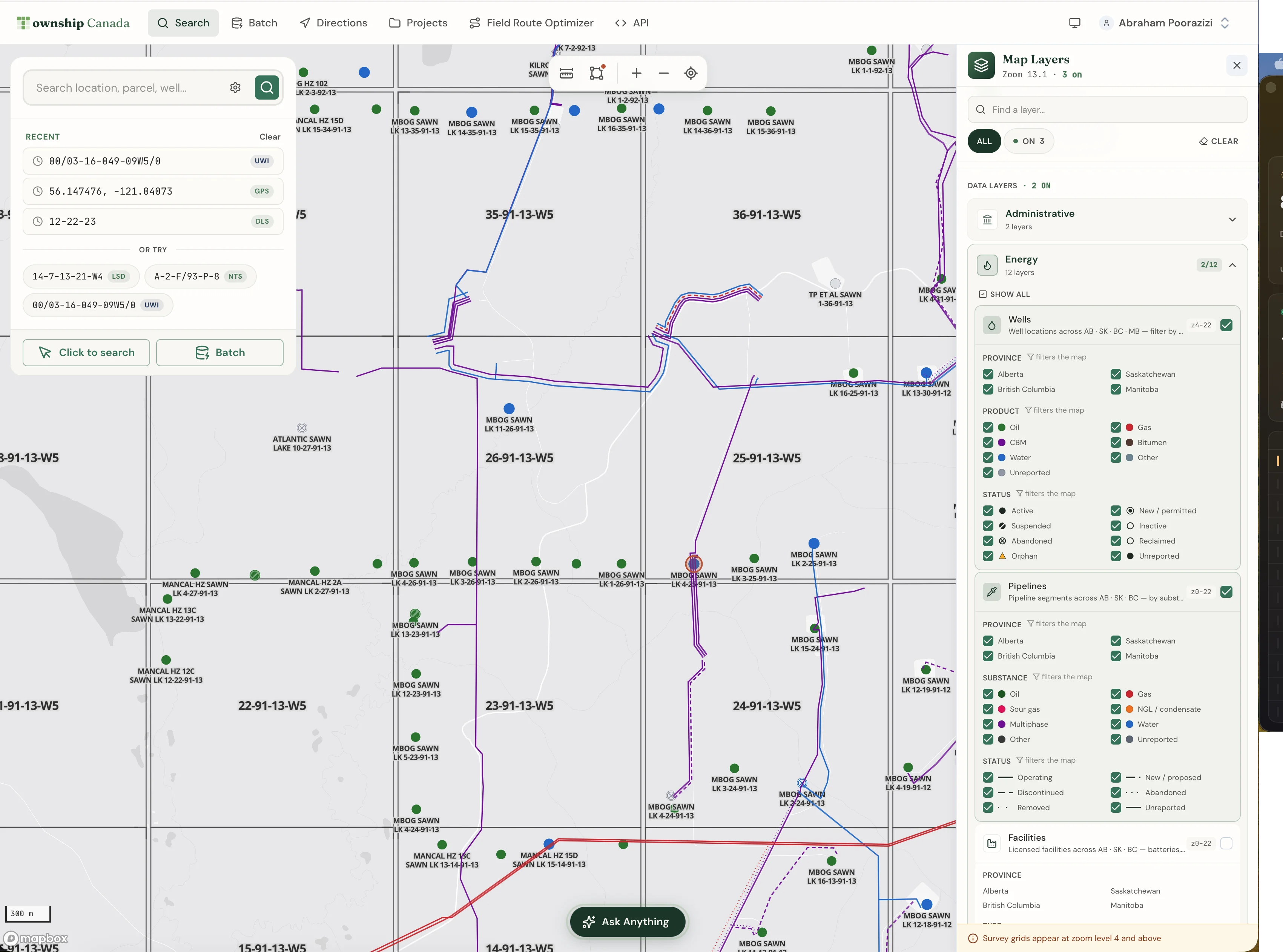Wells, Pipelines, and Facilities layers toggled on the Alberta legal land converter, with the parcel report open for a Pembina area quarter section