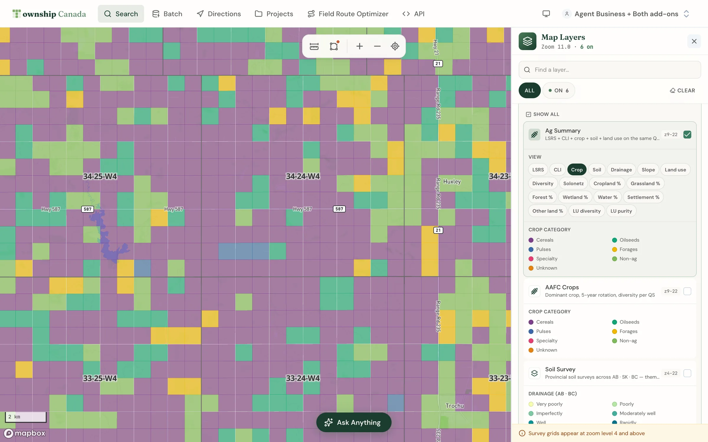 The Ag Summary layer with the Crop view selected in the View switcher, repainting quarter sections near Trochu, Alberta by dominant crop category